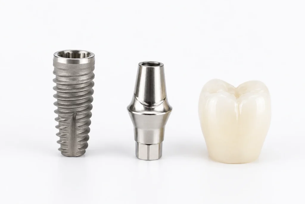 Dental implant components including titanium post, abutment, and crown arranged on a clinical surface at SnapFit Denture Practice Wolverhampton